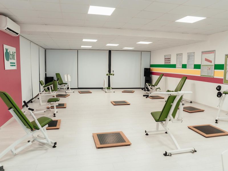 Bright and clean exercise room with minimal equipment.